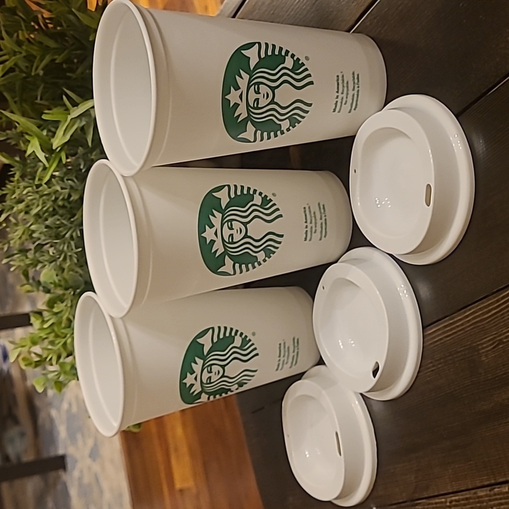 Three reusable starbucks cups
